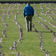 A man walking through a memorial at the National Mall in Washington, DC, created this September to commemorate the 200,000 American lives lost to the pandemic at the time. As many as 500,000 Americans may die before the pandemic ends, some experts have estimated.